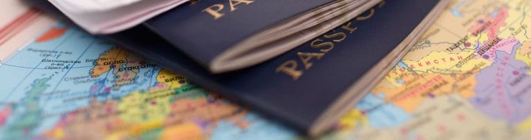 Passports on top of a world map