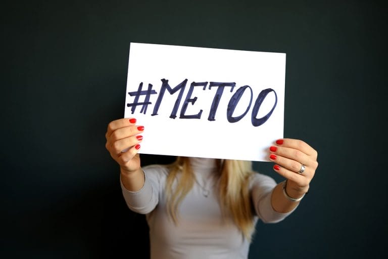 woman holding a #metoo sign